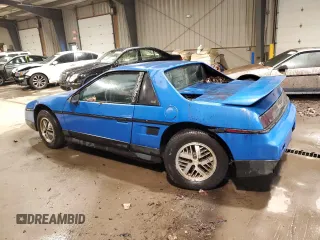1987 Pontiac Fiero z VIN 1G2PF11R6HP237261, wystawiony jako Copart lot #85061534 z przebiegiem Nie podano mil oraz Czysty tytuł • Clean title. Historia ofert i sprzedaży dostępna na DreamBid. Obrazek 2.