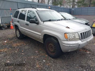 2004 Jeep Grand Cherokee Laredo with VIN 1J4GW48SX4C367772, listed as a IAAI auction lot 41995373 with 220,201 mi miles. Bid and sale history available at carsss.com. Image 1.