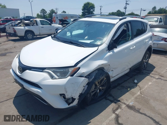 2018 Toyota RAV4 XLE z VIN 2T3WFREV1JW459553, wystawiony jako IAAI lot #42423474 z przebiegiem 129 523 mil mil oraz . Historia ofert i sprzedaży dostępna na DreamBid. Obrazek 17.