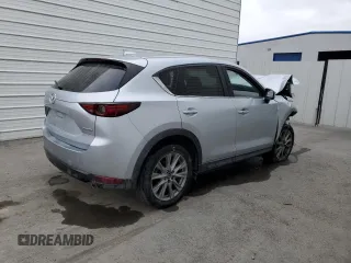 2021 Mazda CX-5 Grand Touring z VIN JM3KFADM7M1339081, wystawiony jako Copart lot #58913585 z przebiegiem Nie podano mil oraz Szkoda całkowita • Salvage title. Historia ofert i sprzedaży dostępna na DreamBid. Obrazek 3.