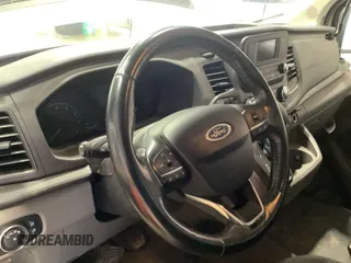 2020 Ford Transit Cargo z VIN 1FTBR1Y8XLKB06141, wystawiony jako IAAI lot #42642640 z przebiegiem 123 417 mil mil oraz . Historia ofert i sprzedaży dostępna na DreamBid. Obrazek 26.