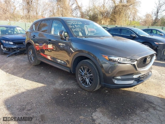 2020 Mazda CX-5 Touring with VIN JM3KFACM2L0786598, listed as a IAAI auction lot 41933368 with 93,657 mi miles. Bid and sale history available at carsss.com. Image 1.