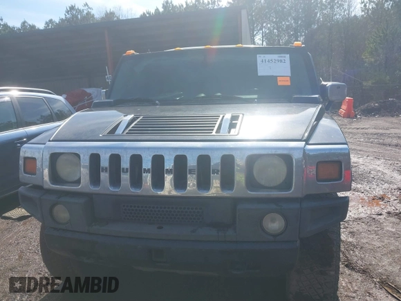 2003 Hummer H2 with VIN 5GRGN23U33H144379, listed as a IAAI auction lot 41452982 with 227,746 mi miles. Bid and sale history available at carsss.com. Image 6.