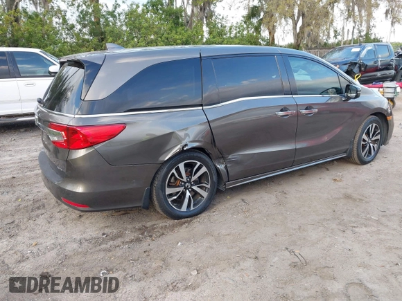 2020 Honda Odyssey Elite with VIN 5FNRL6H91LB030294, listed as a IAAI auction lot 41608291 with 74,477 mi miles and . Bid and sale history available at DreamBid. Image 4.