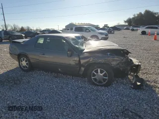 1999 Cadillac Eldorado Touring z VIN 1G6ET1299XU612153, wystawiony jako Copart lot #86257044 z przebiegiem Nie podano mil oraz Nie do naprawy. Historia ofert i sprzedaży dostępna na DreamBid. Obrazek 4.
