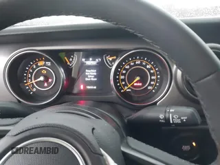 2023 Jeep Wrangler Sport S with VIN 1C4HJXDN5PW609316, listed as a IAAI auction lot 40960863 with 15,614 mi miles and . Bid and sale history available at DreamBid. Image 7.