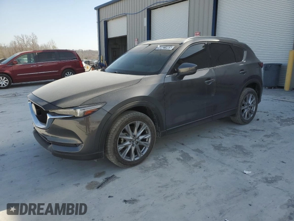 2021 Mazda CX-5 Grand Touring with VIN JM3KFBDM0M1464817, listed as a Copart auction lot 48821965 with 53,648 mi miles and Clean Title. Bid and sale history available at carsss.com. Image 1.