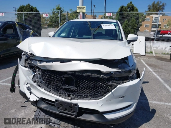 2018 Mazda CX-5 Grand Touring with VIN JM3KFADM8J0373368, listed as a IAAI auction lot 42013535 with 63,142 mi miles and . Bid and sale history available at DreamBid. Image 12.