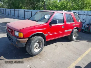 1994 Isuzu Rodeo LS z VIN 4S2CY58V6R4322459, wystawiony jako IAAI lot #42476512 z przebiegiem 179 635 mil mil oraz . Historia ofert i sprzedaży dostępna na DreamBid. Obrazek 2.