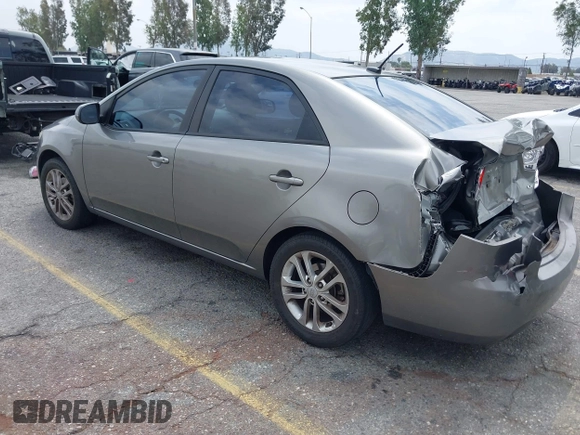 2012 Kia Forte EX with VIN KNAFU4A2XC5560585, listed as a IAAI auction lot 42121133 with 151,079 mi miles. Bid and sale history available at carsss.com. Image 3.