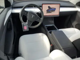 2023 Tesla Model Y Long Range z VIN 7SAYGDEE3PA178832, wystawiony jako Copart lot #57156005 z przebiegiem 12 920 mil mil oraz Szkody całkowita. Historia ofert i sprzedaży dostępna na DreamBid. Obrazek 8.