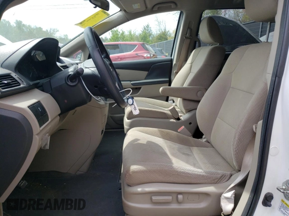 2014 Honda Odyssey LX with VIN 5FNRL5H27EB116435, listed as a Copart auction lot 52864825 with 94,643 mi miles and Salvage Title. Bid and sale history available at DreamBid. Image 7.