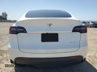 2023 Tesla Model Y Long Range z VIN 7SAYGDEE2PA061792, wystawiony jako Copart lot #52106965 z przebiegiem 11 968 mil mil oraz Szkoda całkowita • Salvage title. Historia ofert i sprzedaży dostępna na DreamBid. Obrazek 6.