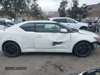 2014 Scion tC with VIN JTKJF5C79E3075707, listed as a IAAI auction lot 41557310 with 132,468 mi miles. Bid and sale history available at carsss.com. Image 14.