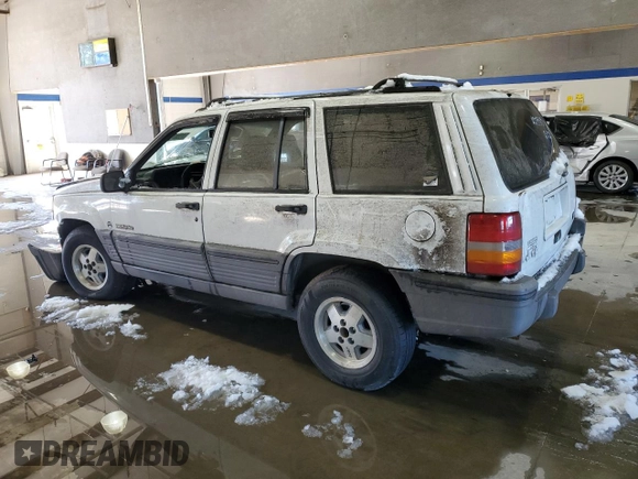 1993 Jeep Grand Cherokee Laredo with VIN 1J4GZ58Y2PC658787, listed as a Copart auction lot 41687765 with 166,262 mi miles and Salvage Title. Bid and sale history available at carsss.com. Image 2.