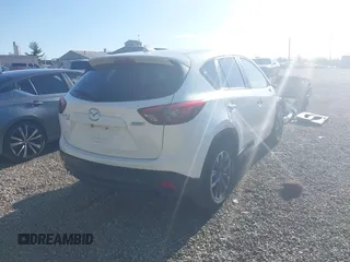 2016 Mazda CX-5 Grand Touring with VIN JM3KE4DY1G0680431, listed as a IAAI auction lot 42136637 with 166,348 mi miles. Bid and sale history available at carsss.com. Image 4.