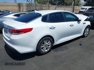 2016 Kia Optima LX z VIN 5XXGT4L37GG026140, wystawiony jako IAAI lot #42153942 z przebiegiem 128 919 mil mil oraz . Historia ofert i sprzedaży dostępna na DreamBid. Obrazek 4.