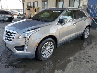 2019 Cadillac XT5 Luxury FWD z VIN 1GYKNCRS4KZ221304, wystawiony jako Copart lot #54995415 z przebiegiem 128 940 mil mil oraz Szkoda całkowita • Salvage title. Historia ofert i sprzedaży dostępna na DreamBid. Obrazek 1.