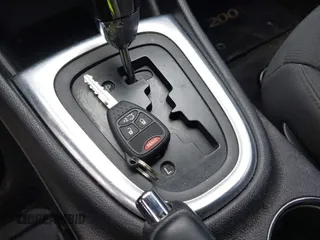2014 Chrysler 200 LX with VIN 1C3CCBAB5EN211113, listed as a IAAI auction lot 41948163 with 143,355 mi miles and . Bid and sale history available at carsss.com. Image 11.