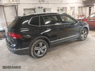2020 Volkswagen Tiguan SE with VIN 3VV2B7AX4LM115131, listed as a IAAI auction lot 42017352 with 87,909 mi miles. Bid and sale history available at carsss.com. Image 4.