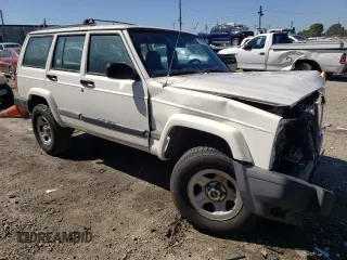 1999 Jeep Cherokee Sport with VIN 1J4FT68S9XL627003, listed as a Copart auction lot 49478595 with 320,444 mi miles and Salvage title. Bid and sale history available at DreamBid. Image 4.