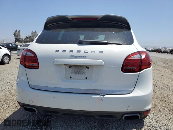 2014 Porsche Cayenne with VIN WP1AA2A28ELA09742, listed as a Copart auction lot 61779285 with 182,380 mi miles and Salvage title. Bid and sale history available at DreamBid. Image 6.