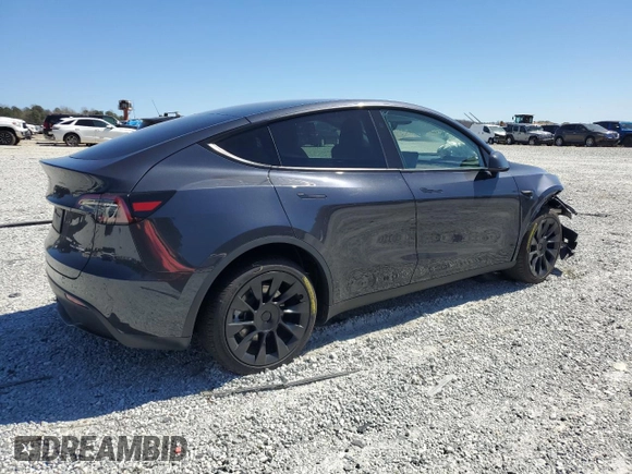 2025 Tesla Model Y Long Range with VIN 7SAYGAEEXSF253326, listed as a Copart auction lot 49527965 with 5,803 mi miles and Salvage Title. Bid and sale history available at DreamBid. Image 3.