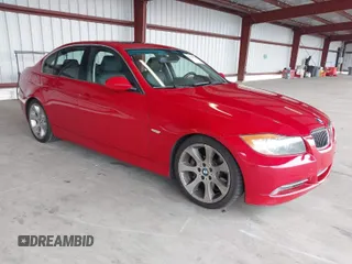 2007 BMW 3 Series 335i with VIN WBAVB73587P100572, listed as a IAAI auction lot 41409539 with 124,650 mi miles. Bid and sale history available at carsss.com. Image 1.