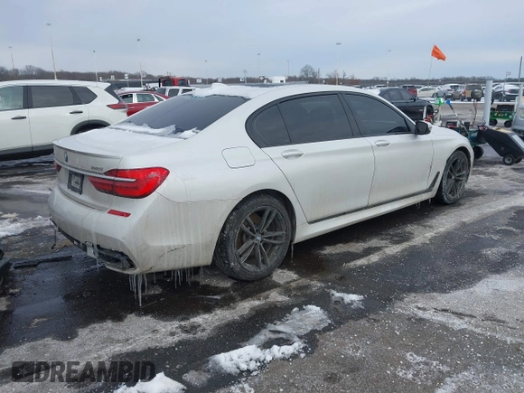 2018 BMW 7 Series 740i xDrive with VIN WBA7E4C59JGV23876, listed as a IAAI auction lot 41381398 with 106,675 mi miles. Bid and sale history available at carsss.com. Image 4.