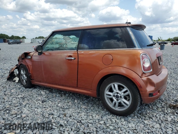 2011 MINI Hardtop with VIN WMWSU3C52BT094399, listed as a Copart auction lot 56561635 with 94,428 mi miles and Salvage Title. Bid and sale history available at DreamBid. Image 2.