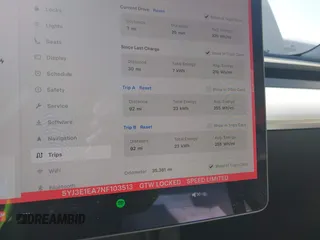 2022 Tesla Model 3 with VIN 5YJ3E1EA7NF103513, listed as a IAAI auction lot 41643592 with 35,631 mi miles and . Bid and sale history available at DreamBid. Image 7.