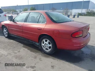 1999 Oldsmobile Intrigue GL z VIN 1G3WS52H1XF363368, wystawiony jako IAAI lot #41611295 z przebiegiem 83 232 mil mil oraz . Historia ofert i sprzedaży dostępna na DreamBid. Obrazek 3.