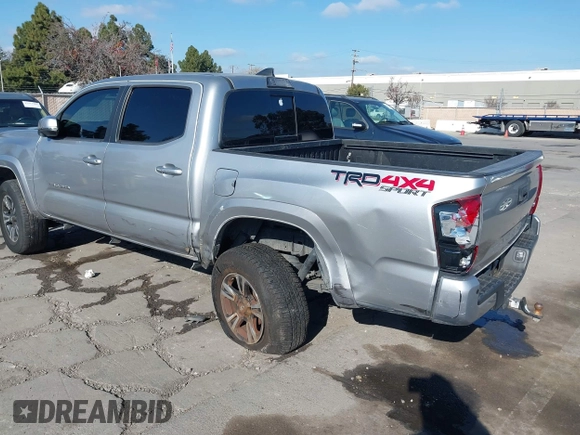 2018 Toyota Tacoma SR with VIN 3TMCZ5AN6JM185891, listed as a IAAI auction lot 41450665 with 53,749 mi miles and . Bid and sale history available at DreamBid. Image 3.