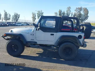 2005 Jeep Wrangler X with VIN 1J4FA39S55P348432, listed as a IAAI auction lot 41868451 with 166,876 mi miles. Bid and sale history available at carsss.com. Image 14.