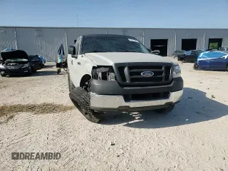 2005 Ford F-150 XL with VIN 1FTRF12235NC10435, listed as a Copart auction lot 57311935 with 249,847 mi miles and Salvage title. Bid and sale history available at DreamBid. Image 14.