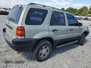 2004 Ford Escape with VIN 1FMCU02194DA23228, listed as a Copart auction lot 72161464 with 167,233 mi miles and Salvage title. Bid and sale history available at DreamBid. Image 3.