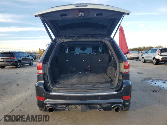 2012 Jeep Grand Cherokee SRT8 with VIN 1C4RJFDJ9CC346867, listed as a Copart auction lot 86349154 with 125,130 mi miles and Salvage Title. Bid and sale history available at carsss.com. Image 6.
