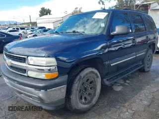 2005 Chevrolet Tahoe LT with VIN 1GNEC13T15R213638, listed as a IAAI auction lot 41787524 with 153,709 mi miles and . Bid and sale history available at DreamBid. Image 2.