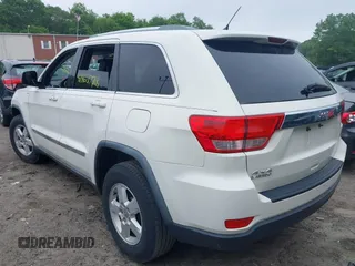 2011 Jeep Grand Cherokee Laredo with VIN 1J4RR4GG0BC670506, listed as a IAAI auction lot 42462778 with 241,406 mi miles and . Bid and sale history available at DreamBid. Image 3.