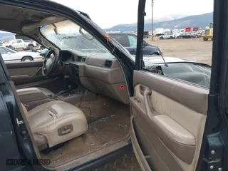 1996 Toyota Land Cruiser with VIN JT3HJ85J4T0115628, listed as a IAAI auction lot 41191476 with 210,005 mi miles. Bid and sale history available at carsss.com. Image 5.