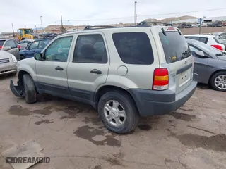 2003 Ford Escape XLT Popular 2 with VIN 1FMYU93183KB80977, listed as a IAAI auction lot 41657209 with 1 mi miles. Bid and sale history available at carsss.com. Image 3.