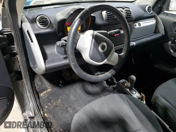 2011 Smart fortwo Pure с VIN WMEEJ3BA5BK480412, выставлен на аукционе Copart как лот 87023194 с пробегом 70 496 миль миль и Списание • Salvage title. История ставок и продаж доступна на DreamBid. Изображение 8.