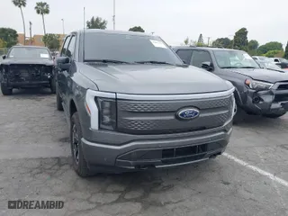 2023 Ford F-150 Lightning Pro with VIN 1FTVW1EL8PWG48559, listed as a IAAI auction lot 42033123 with 8,845 mi miles. Bid and sale history available at carsss.com. Image 1.