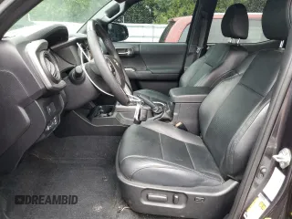2020 Toyota Tacoma SR5 with VIN 3TMDZ5BN2LM097782, listed as a Copart auction lot 61573465 with 57,321 mi miles and Salvage title. Bid and sale history available at DreamBid. Image 7.