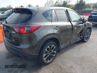 2016 Mazda CX-5 Grand Touring z VIN JM3KE4DY2G0684066, wystawiony jako IAAI lot #42078725 z przebiegiem 200 129 mil mil oraz . Historia ofert i sprzedaży dostępna na DreamBid. Obrazek 4.