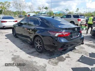 2023 Toyota Camry SE with VIN 4T1G11AK6PU741172, listed as a IAAI auction lot 41599909 with 56,668 mi miles and . Bid and sale history available at DreamBid. Image 3.