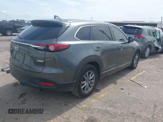 2019 Mazda CX-9 Sport with VIN JM3TCABY0K0327361, listed as a IAAI auction lot 42362232 with 264,699 mi miles and . Bid and sale history available at DreamBid. Image 4.