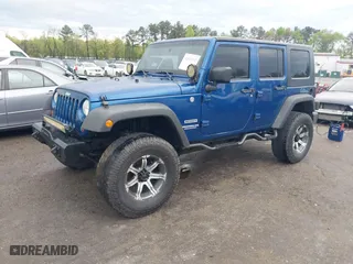 2010 Jeep Wrangler Unlimited Sport with VIN 1J4BA3H11AL144560, listed as a IAAI auction lot 42013032 with 226,233 mi miles. Bid and sale history available at carsss.com. Image 2.