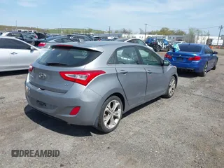 2014 Hyundai Elantra GT with VIN KMHD35LH8EU216052, listed as a IAAI auction lot 42102173 with 112,129 mi miles. Bid and sale history available at carsss.com. Image 4.