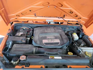 2013 Jeep Wrangler Unlimited Sport with VIN 1C4BJWDG7DL557119, listed as a Copart auction lot 63186715 with 86,241 mi miles and Salvage title. Bid and sale history available at DreamBid. Image 12.